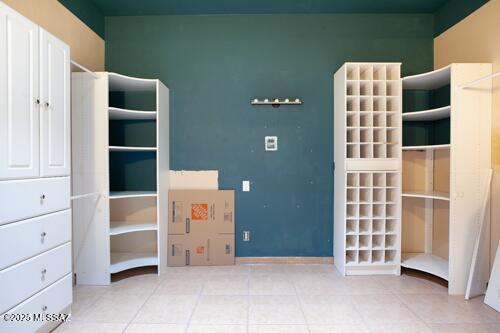 480 Camino Ramanote Rio Rico, AZ 85648 - Photo 16 of 43 Primary bedroom Large Walk-in Closet with shelving.