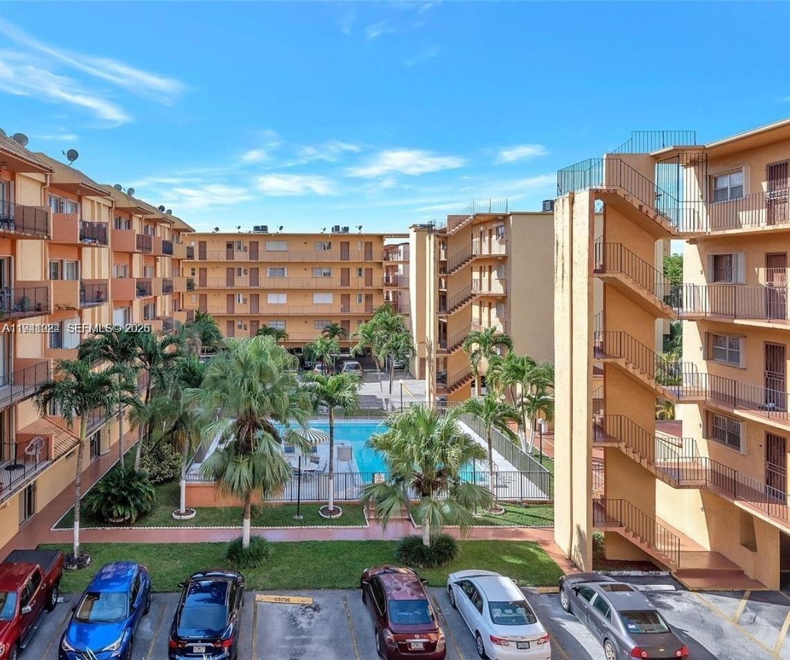 1900 West 54th Street, Unit 307 Hialeah, FL 33012 - Photo 7 of 7 a multi story building with glass windows