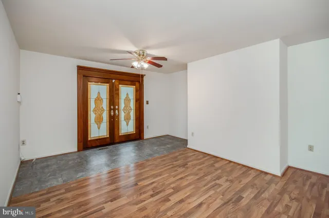a view of an empty room with glass door