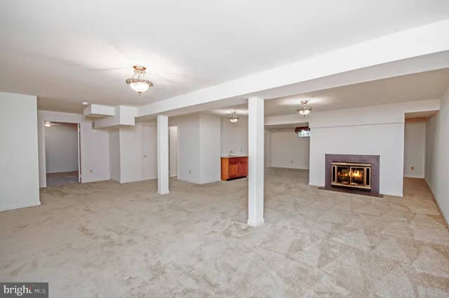 en view interior of a house with an empty space and a fireplace