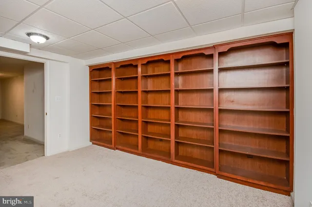 a view of an empty room with empty shelves
