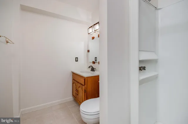 a room with a toilet and a shower curtain