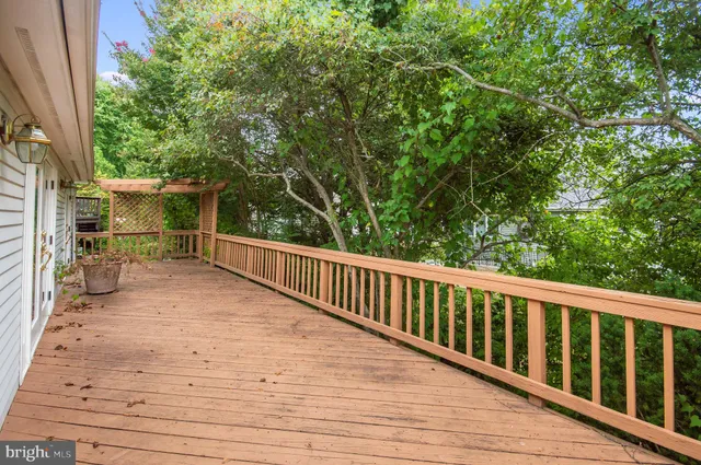 a view of a balcony with wooden floor