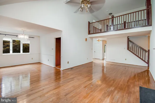 a view of an entryway with wooden floor