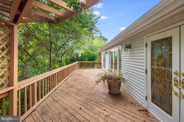 a view of a balcony with wooden floor
