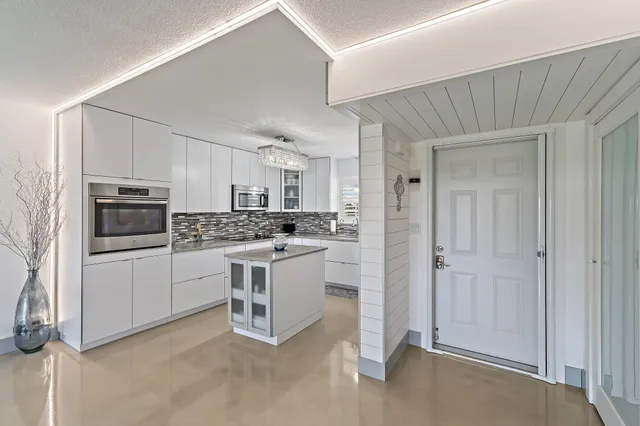 a bedroom with a large bed and a fireplace