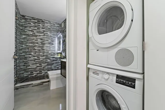 a view of a patio with table and chairs and potted plants