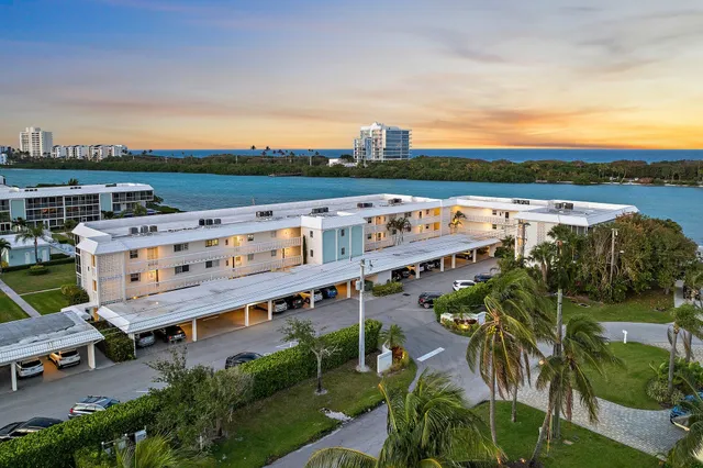 a view of a swimming pool with lawn chairs