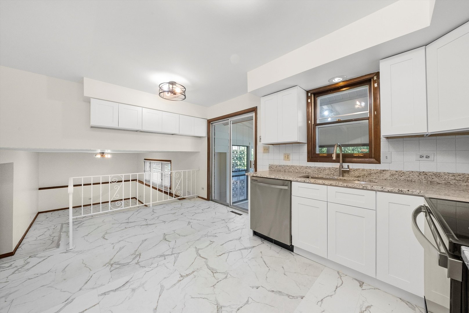 17731 Larkspur Lane Homewood, IL 60430 - Photo 12 of 38 a large white kitchen with a sink and cabinets