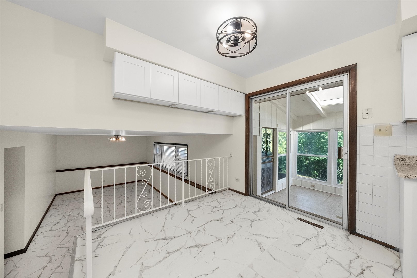 17731 Larkspur Lane Homewood, IL 60430 - Photo 13 of 38 a view of a hallway with a large window and a rug