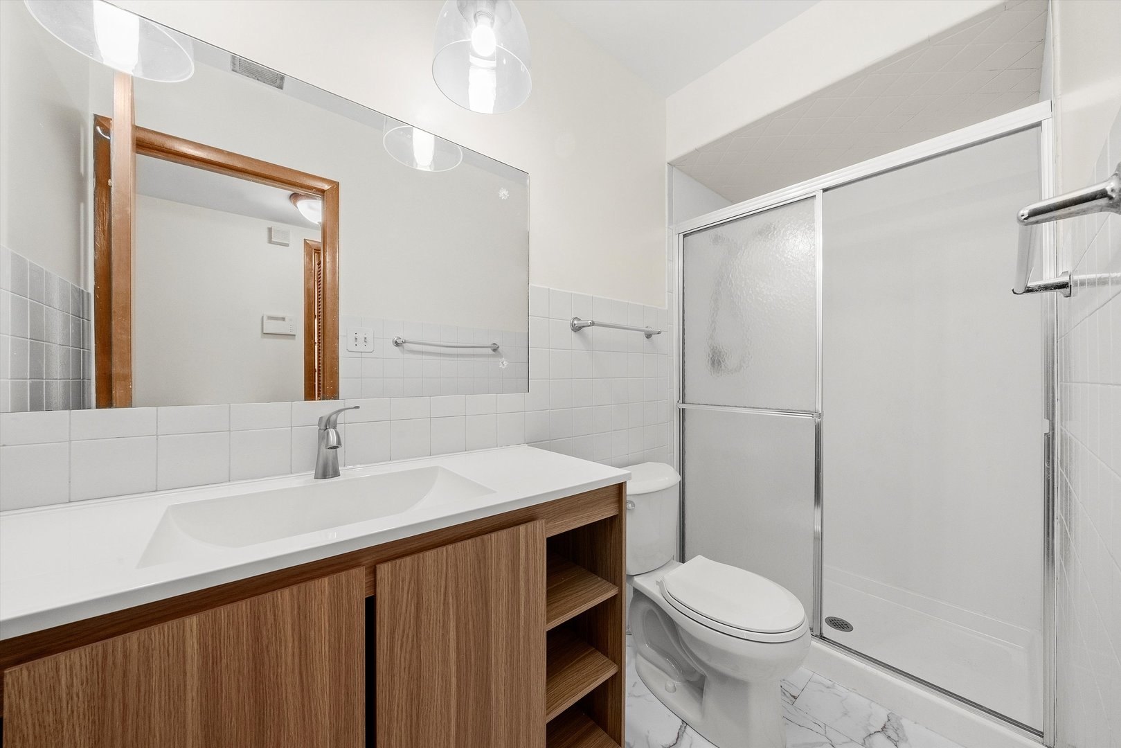 17731 Larkspur Lane Homewood, IL 60430 - Photo 16 of 38 a bathroom with a sink a toilet and shower
