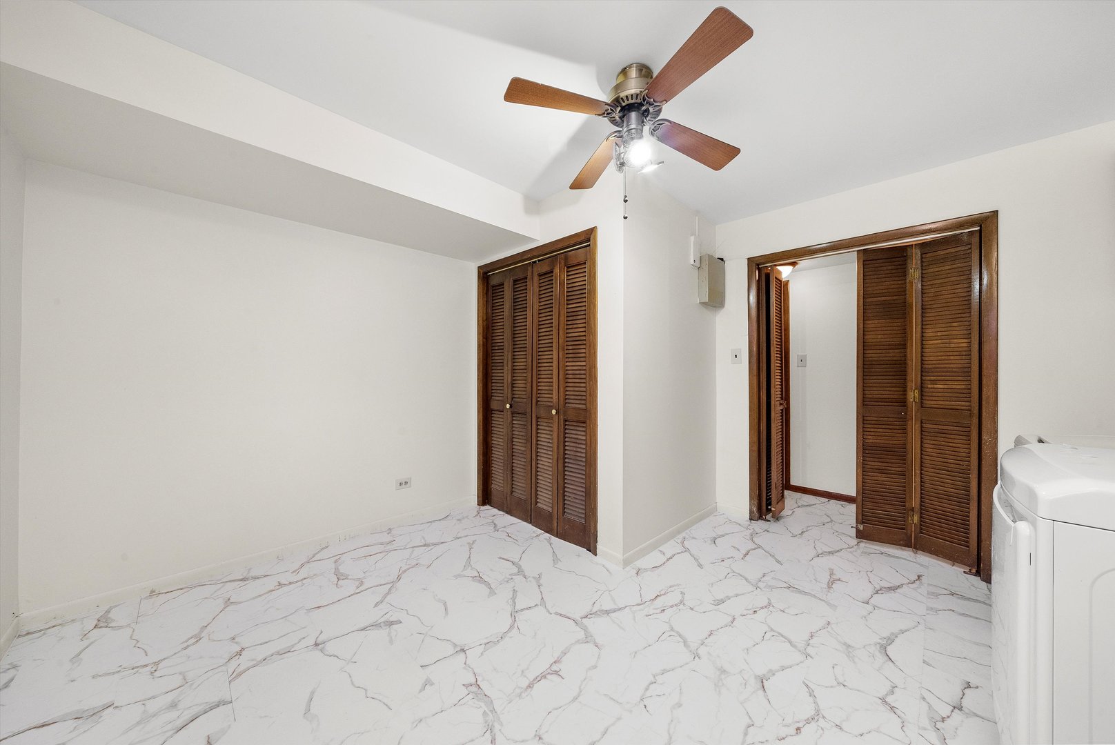 17731 Larkspur Lane Homewood, IL 60430 - Photo 25 of 38 a view of a livingroom with wooden floor and a ceiling fan