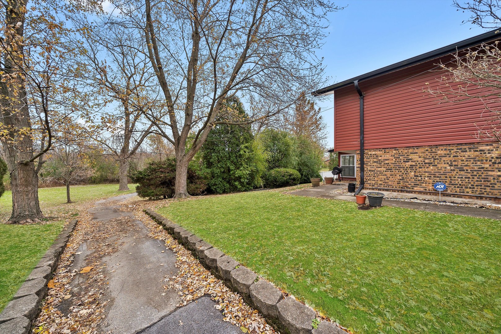 17731 Larkspur Lane Homewood, IL 60430 - Photo 30 of 38 a view of backyard with a garden and trees