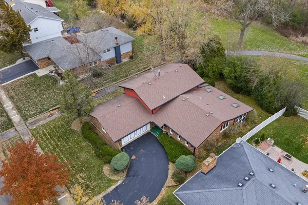 an aerial view of a house with a garden