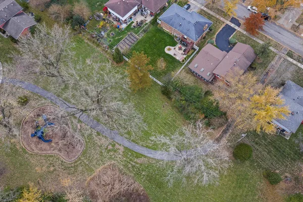 an aerial view of a house with lake view