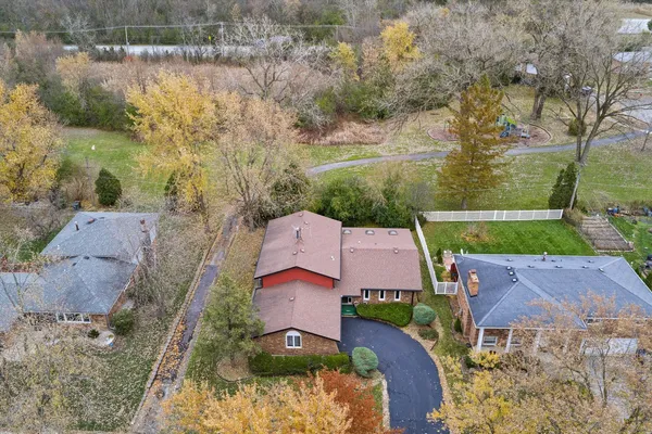 an aerial view of a houses with outdoor space and street view