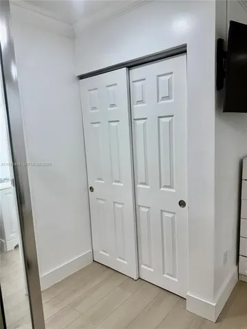 a view of a livingroom with wooden floor