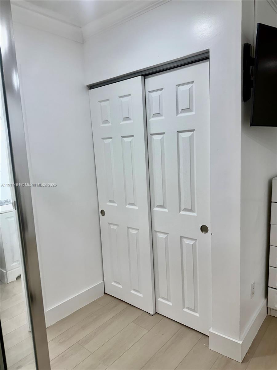 13008 Southwest 50th Lane, Unit 13008 Miami, FL 33175 - Photo 10 of 12 a view of a livingroom with wooden floor