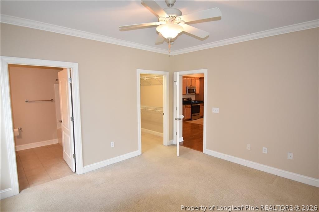 159 Gallery Drive, Unit 201 Spring Lake, NC 28390 - Photo 12 of 18 an empty room with closet and a ceiling fan