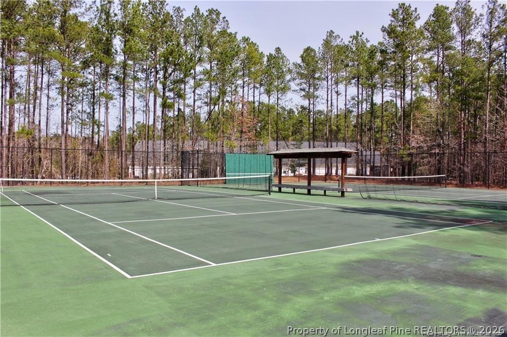 159 Gallery Drive, Unit 201 Spring Lake, NC 28390 - Photo 18 of 18 a view of a tennis ground with large trees