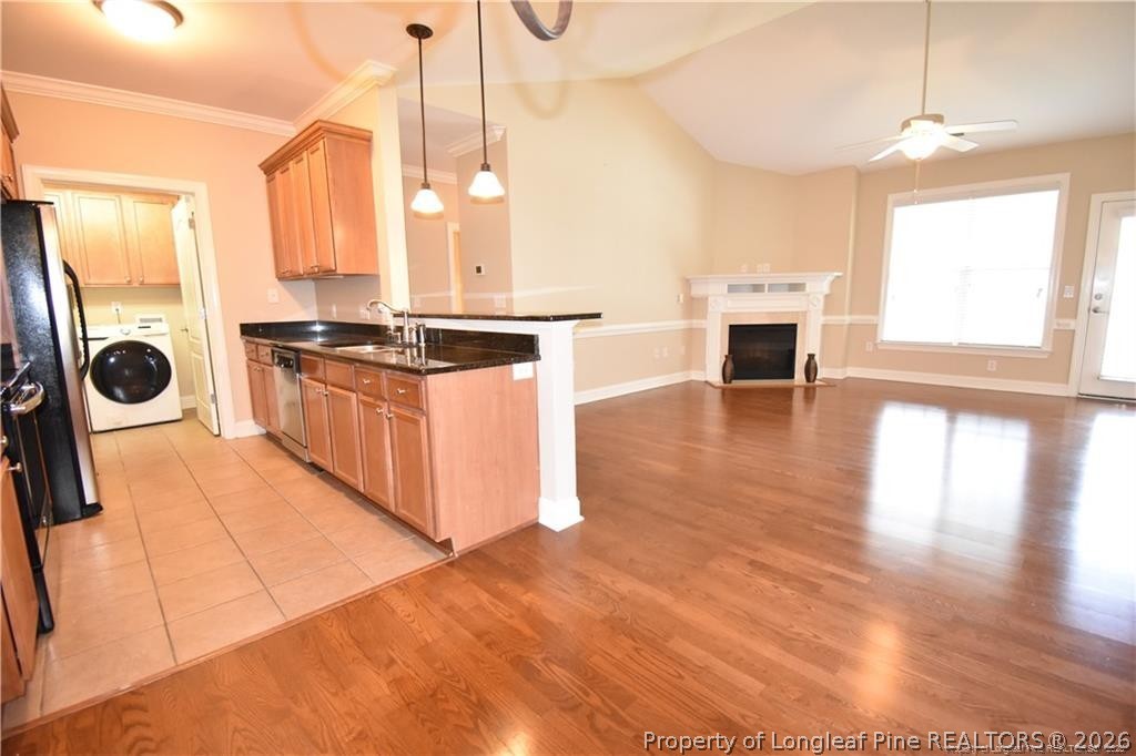 159 Gallery Drive, Unit 201 Spring Lake, NC 28390 - Photo 3 of 18 a kitchen with stainless steel appliances granite countertop a stove a sink and a wooden floors