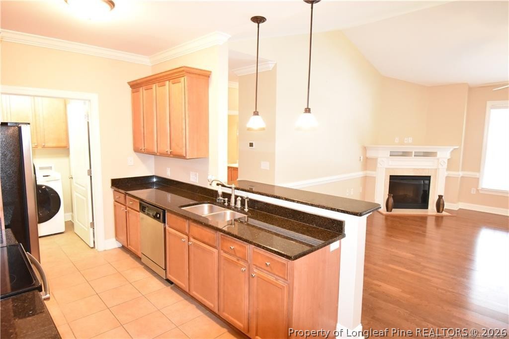 159 Gallery Drive, Unit 201 Spring Lake, NC 28390 - Photo 4 of 18 a kitchen with a stove a sink and a refrigerator
