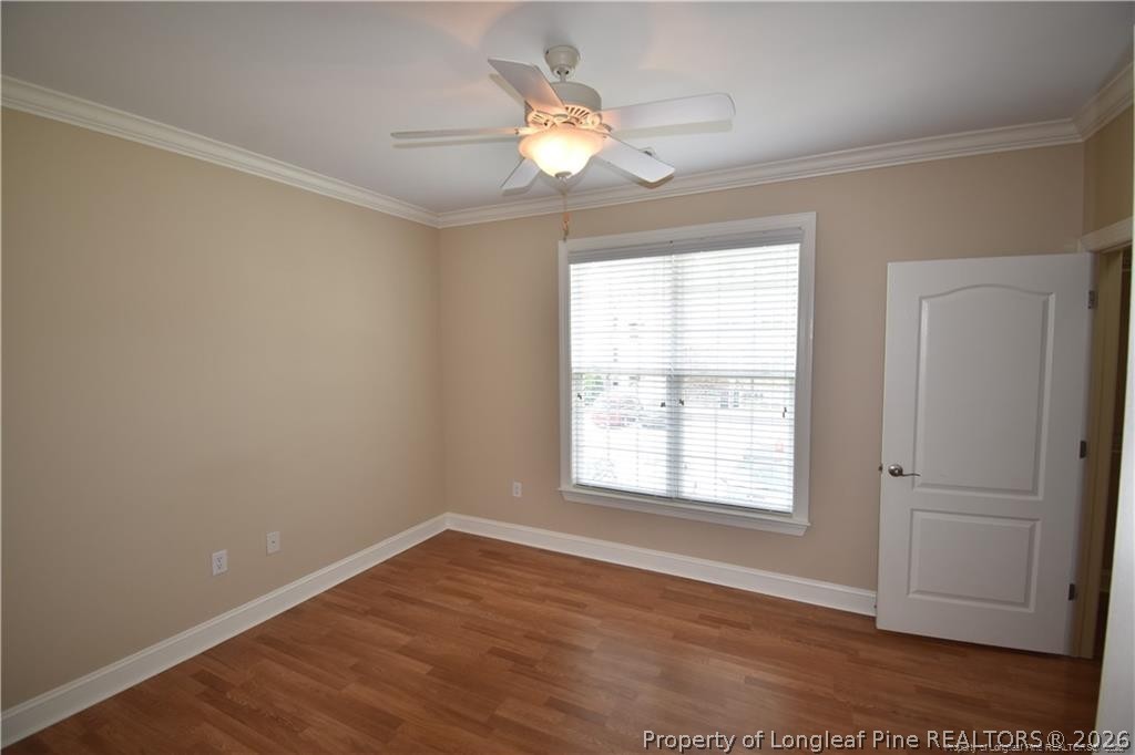 159 Gallery Drive, Unit 201 Spring Lake, NC 28390 - Photo 8 of 18 wooden floor in an empty room with a window