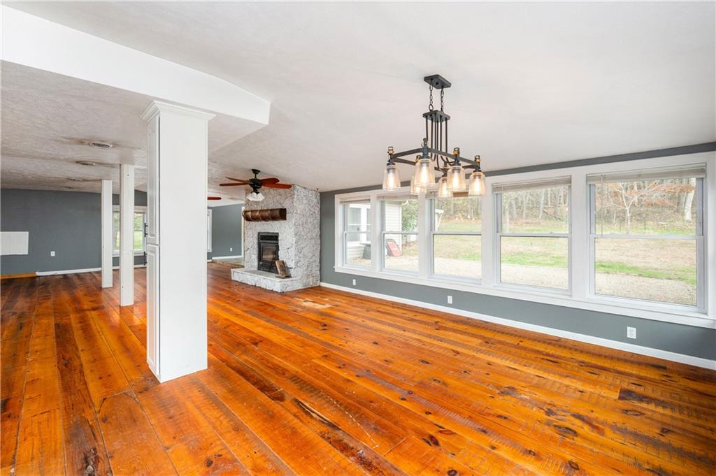172 Queen Junction Road Butler, PA 16001 - Photo 13 of 35 a view of an empty room with wooden floor and a fireplace