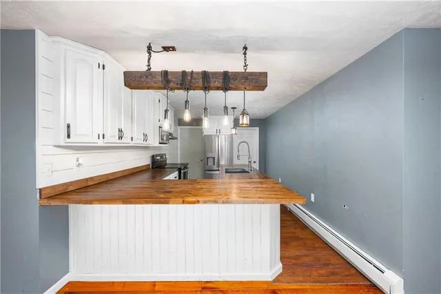 a view of kitchen with wooden floor