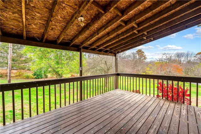 a front view of a house with a yard table and chairs