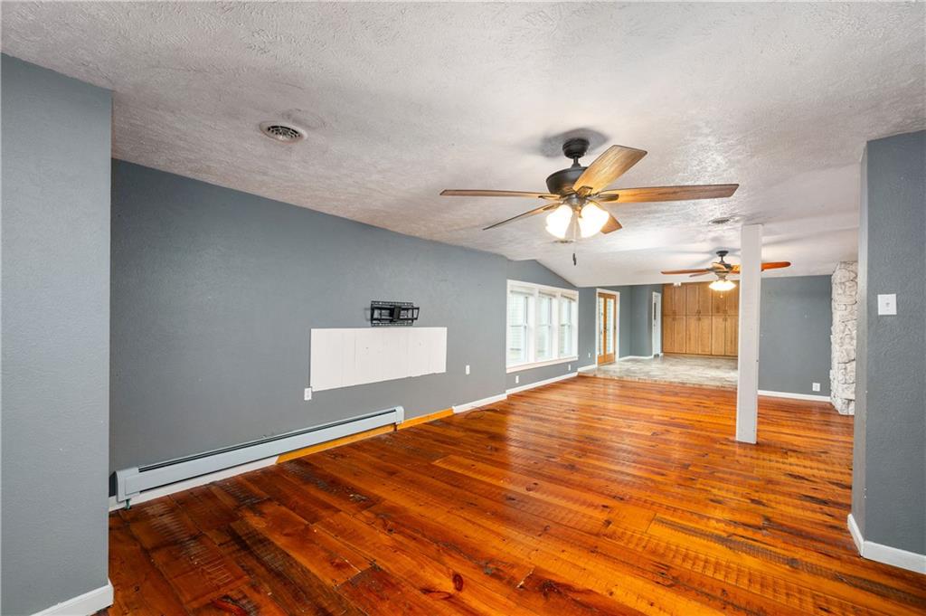 172 Queen Junction Road Butler, PA 16001 - Photo 7 of 35 a bedroom with a bed and a chandelier