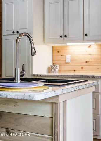 a close view of stove and cabinets