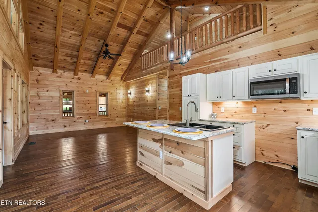 a kitchen with a stove and a white cabinets