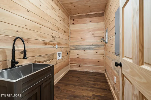 a kitchen with a sink and cabinets