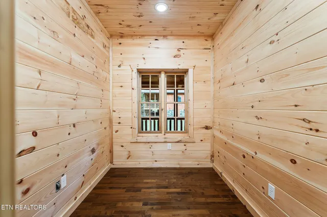 a view of an empty room and wooden floor