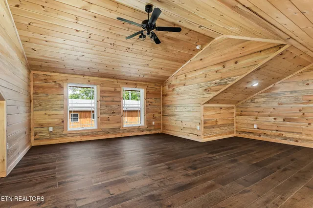 a bathroom with a granite countertop sink and a washing machine