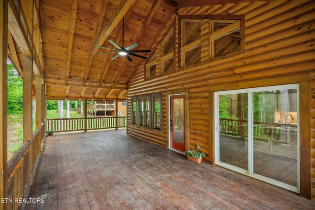 a view of a porch with wooden floor