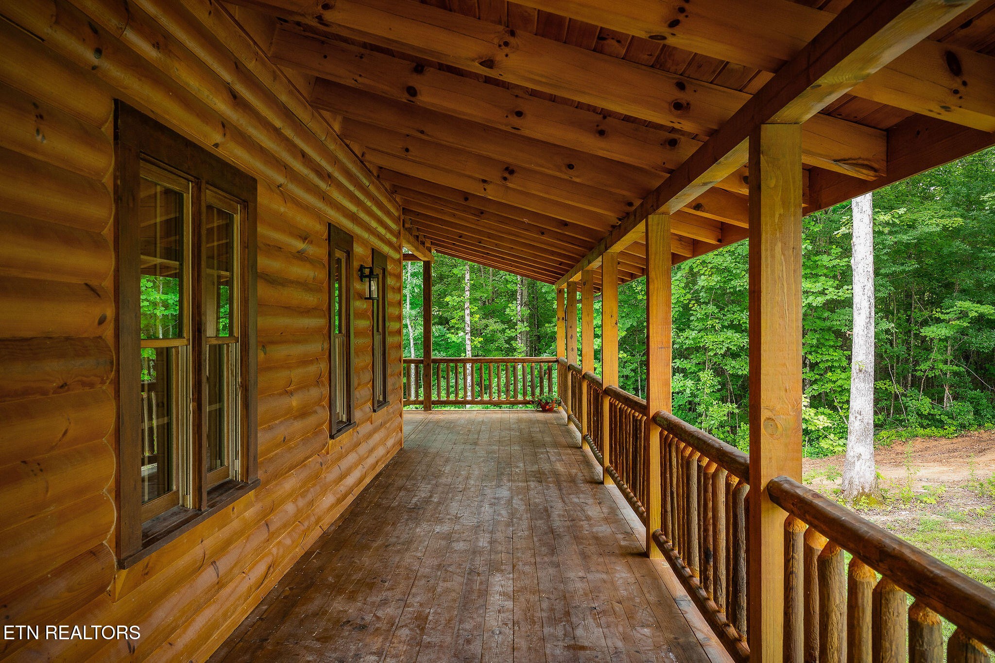 106 Raccoon Lane Jamestown, TN 38556 - Photo 36 of 38 a view of a porch with wooden floor