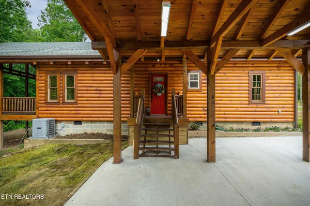 a view of an chairs and tables in the back yard