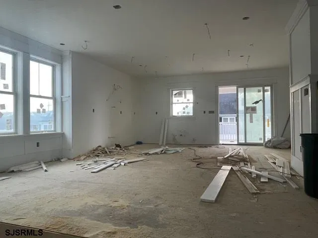 a view of a room with gym equipment and windows