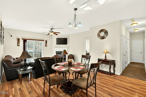 a view of a dining room with furniture and wooden floor