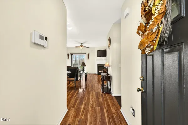 a view of a living room with a wooden floor