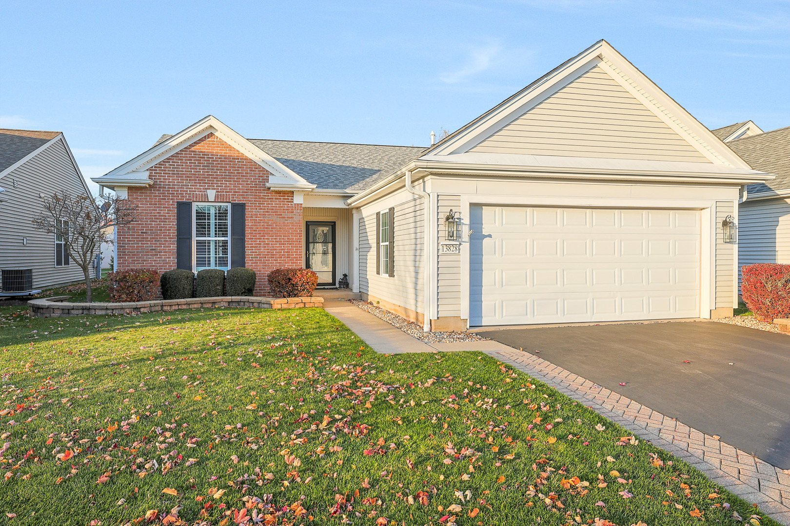 a view of a house with a yard and garage