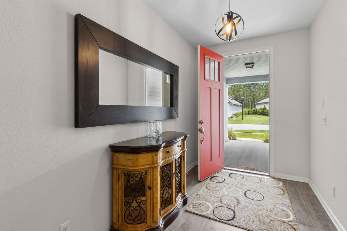 75251 White Rabbit Avenue Yulee, FL 32097 - Photo 13 of 83 a bathroom with a sink a mirror and a window