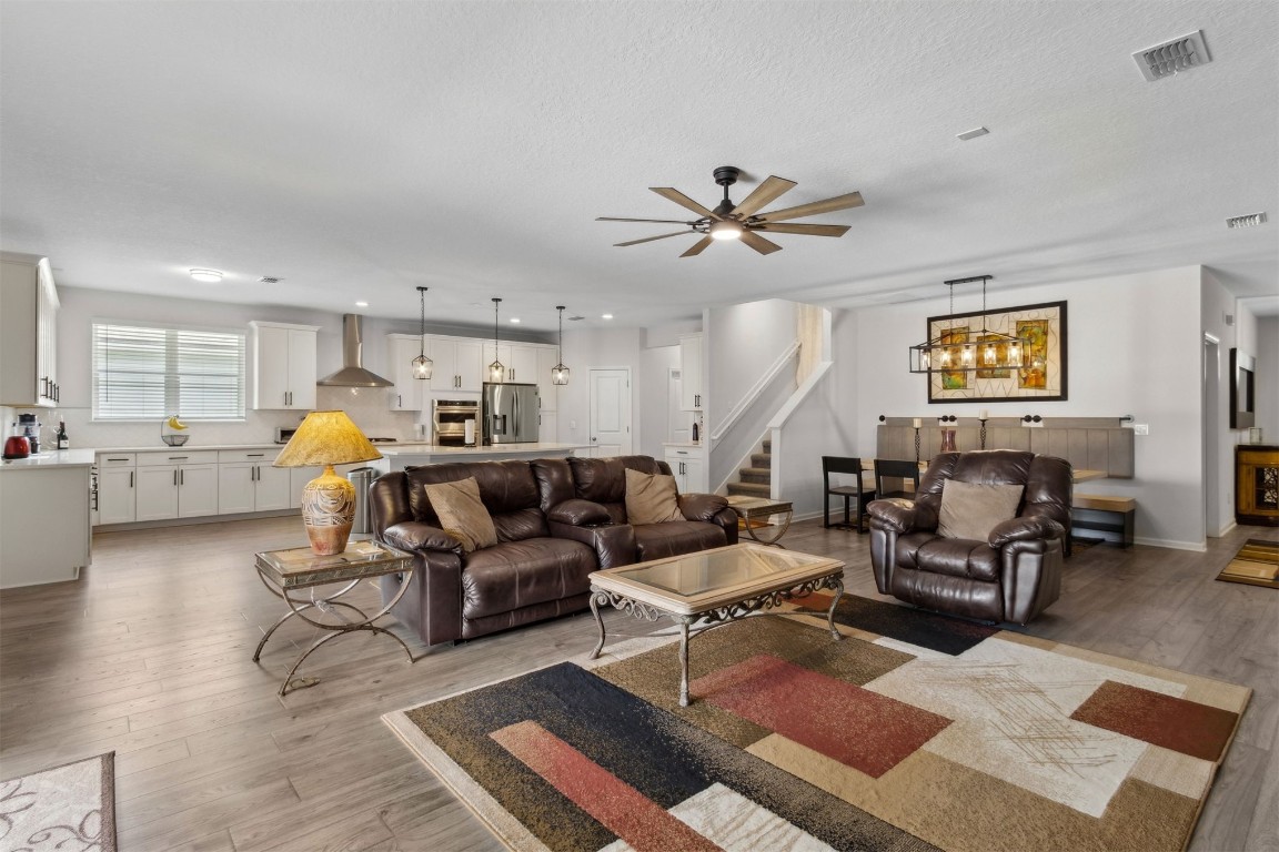 75251 White Rabbit Avenue Yulee, FL 32097 - Photo 17 of 83 a living room with furniture and kitchen view