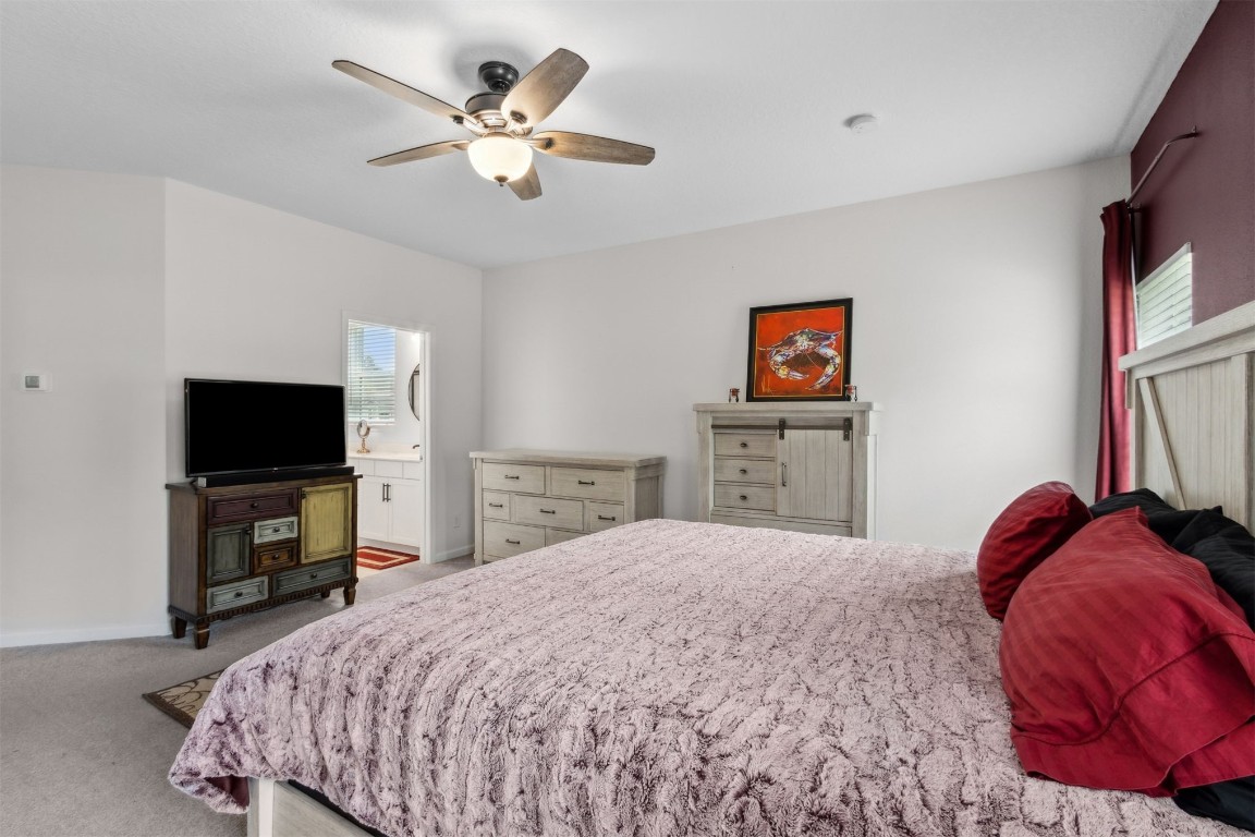 75251 White Rabbit Avenue Yulee, FL 32097 - Photo 24 of 83 a bedroom with a bed and a flat screen tv