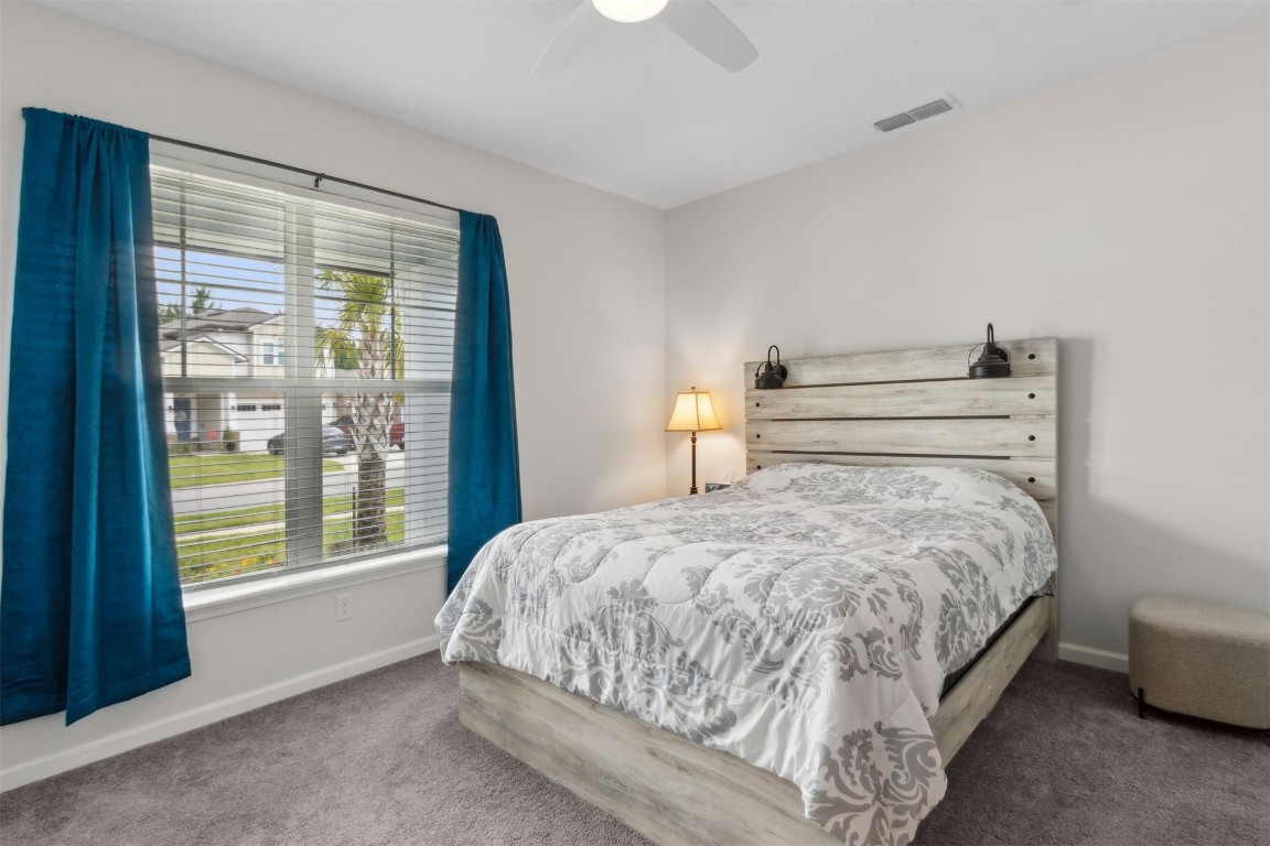75251 White Rabbit Avenue Yulee, FL 32097 - Photo 27 of 83 a bedroom with a bed and window