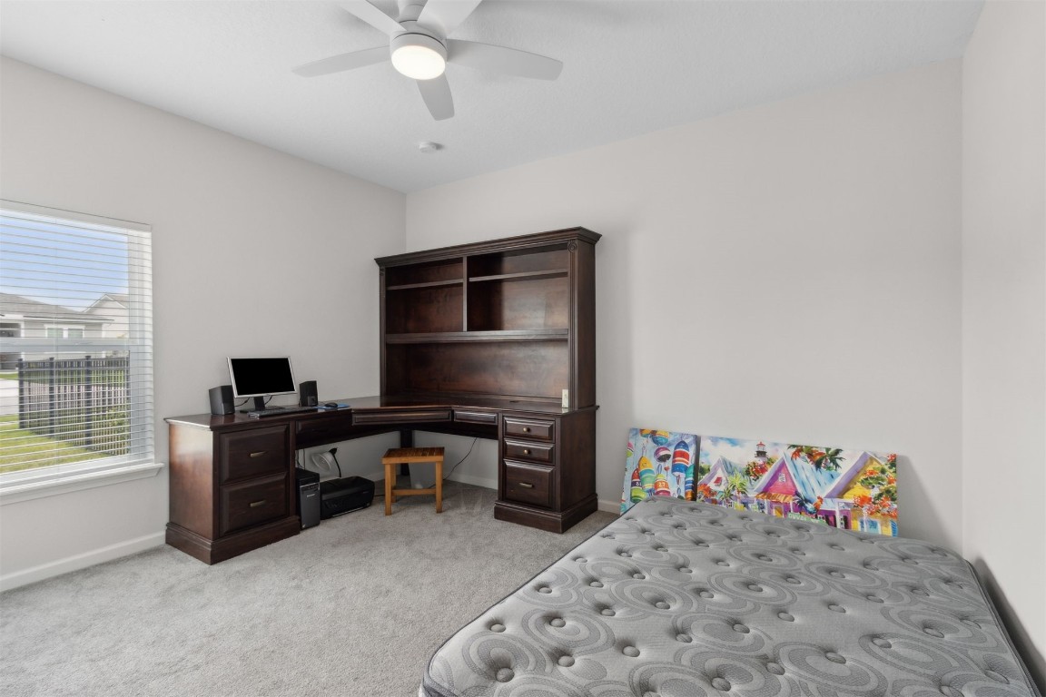 75251 White Rabbit Avenue Yulee, FL 32097 - Photo 30 of 83 a bedroom with a bed and a flat screen tv