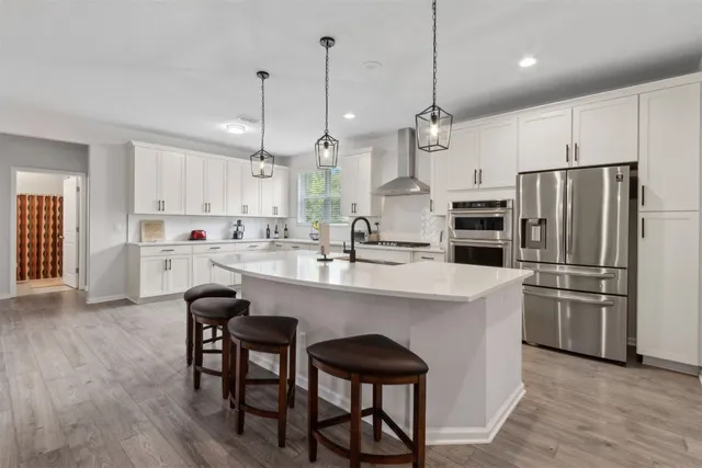 a bedroom with a bed and a dresser in it