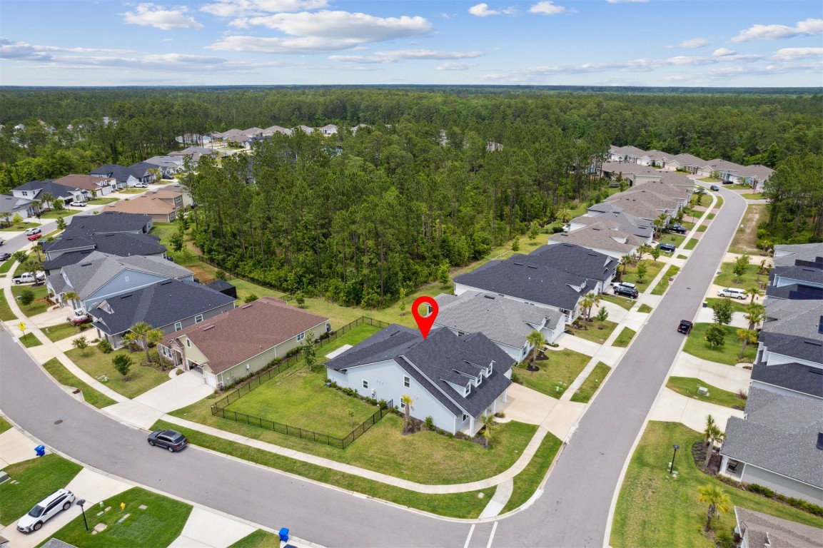75251 White Rabbit Avenue Yulee, FL 32097 - Photo 46 of 83 an aerial view of house with yard swimming pool and outdoor seating